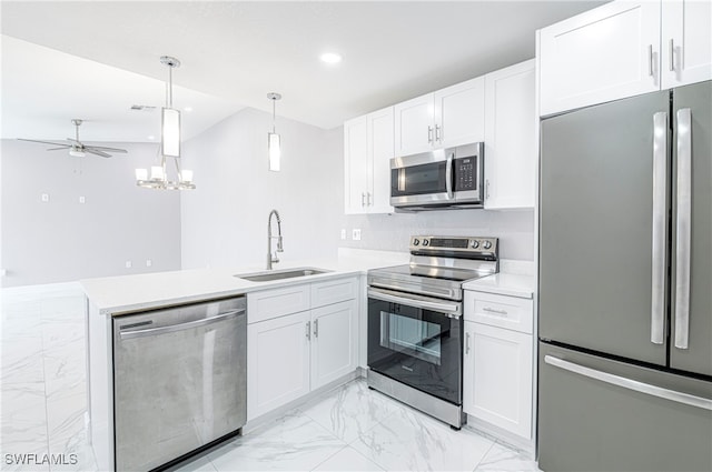 kitchen with appliances with stainless steel finishes, white cabinetry, and sink