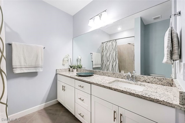 bathroom featuring a shower with curtain, vanity, toilet, and tile patterned floors