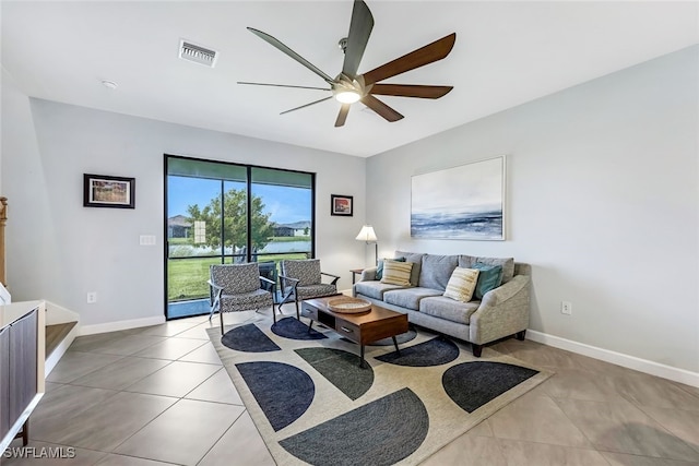 tiled living room featuring ceiling fan