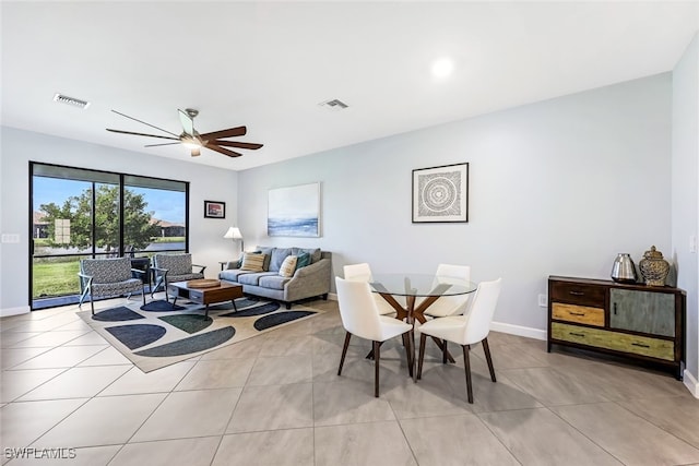 dining area featuring light tile patterned flooring and ceiling fan