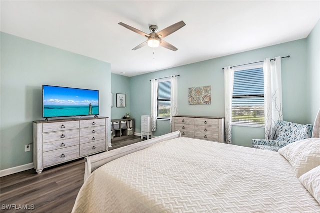 bedroom featuring ceiling fan and dark hardwood / wood-style flooring