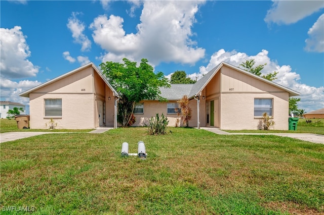 single story home featuring a front yard