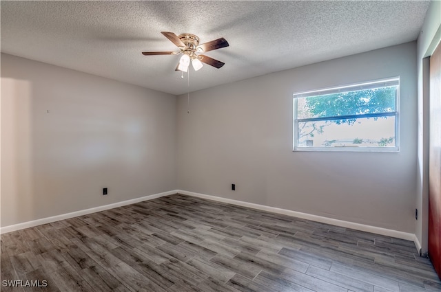 spare room with a textured ceiling, hardwood / wood-style floors, and ceiling fan