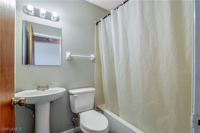 bathroom featuring a textured ceiling, shower / bathtub combination with curtain, and toilet