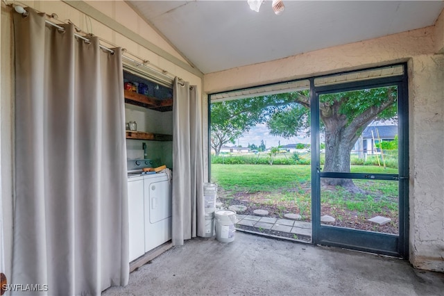 interior space with washer and clothes dryer, lofted ceiling, and concrete flooring