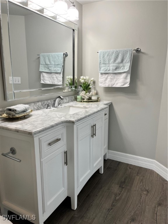 bathroom featuring hardwood / wood-style floors and vanity