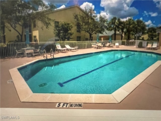 view of pool featuring a patio