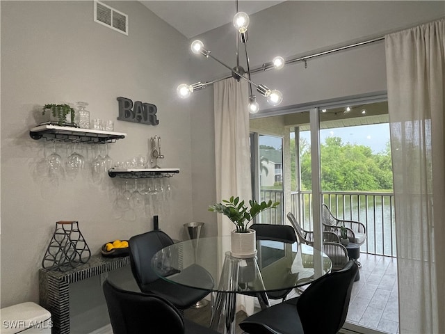 dining space featuring a notable chandelier