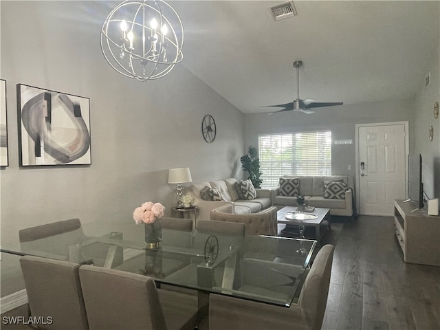 dining room with dark hardwood / wood-style flooring, ceiling fan with notable chandelier, and vaulted ceiling