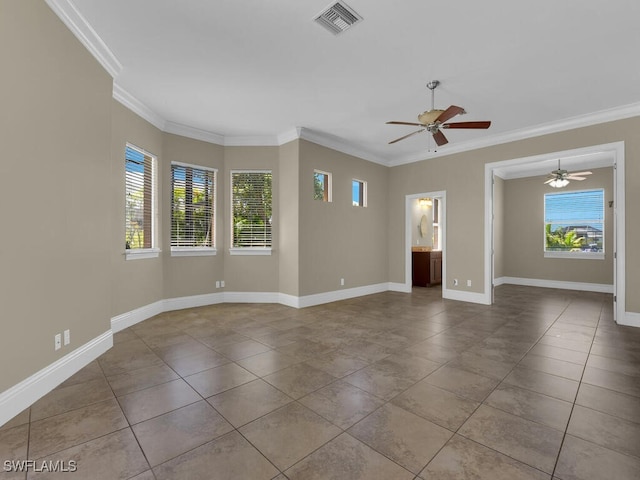 empty room featuring ornamental molding, ceiling fan, and plenty of natural light