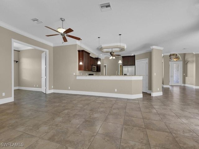 interior space with ceiling fan, crown molding, and sink