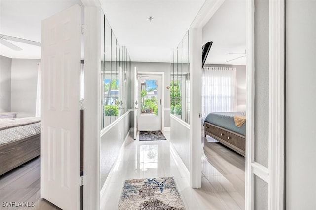 hall featuring light tile patterned floors