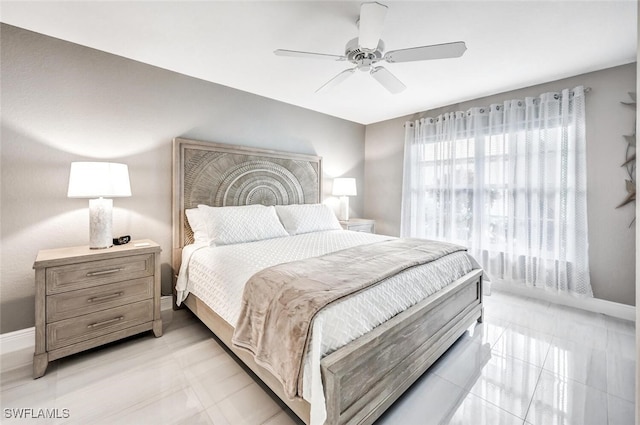 bedroom featuring light tile patterned floors and ceiling fan