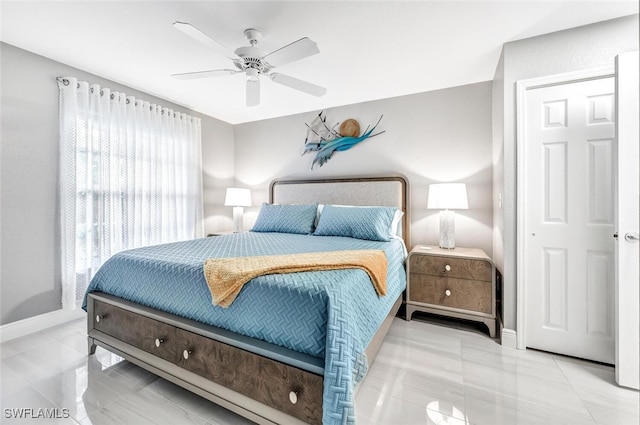 bedroom featuring light tile patterned flooring and ceiling fan