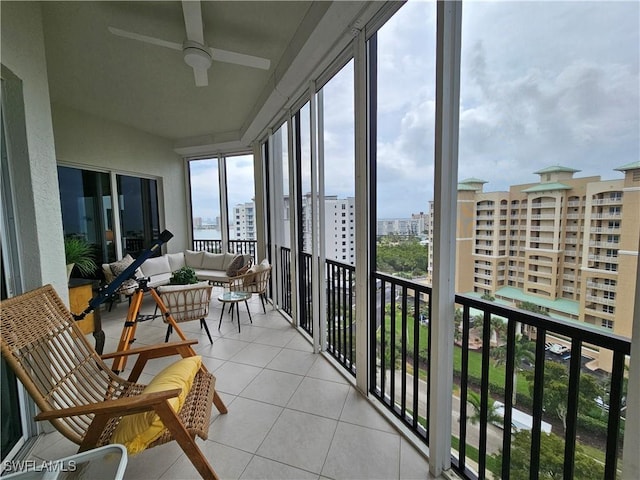 exterior space featuring a ceiling fan and a city view