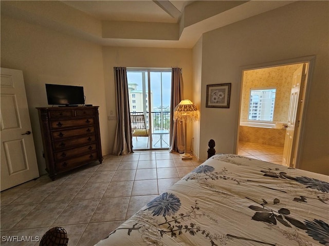 bedroom with access to exterior and light tile patterned flooring