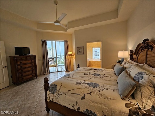 bedroom with access to outside, a raised ceiling, a ceiling fan, and light tile patterned flooring