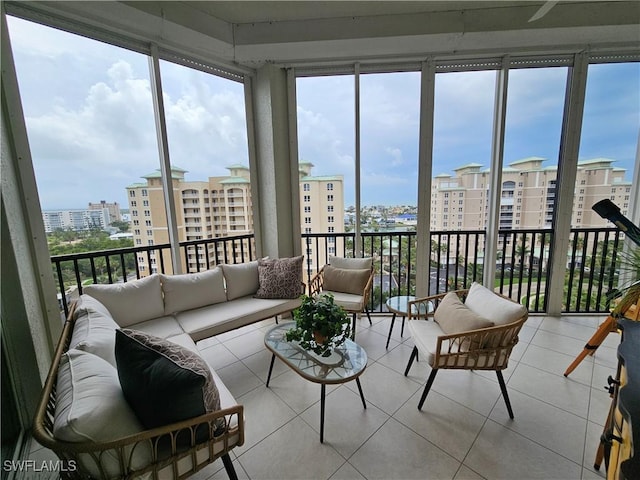 sunroom with plenty of natural light and a city view