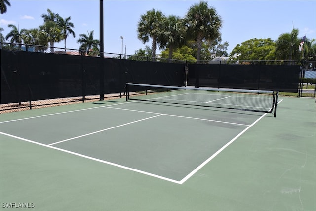 view of sport court with basketball hoop