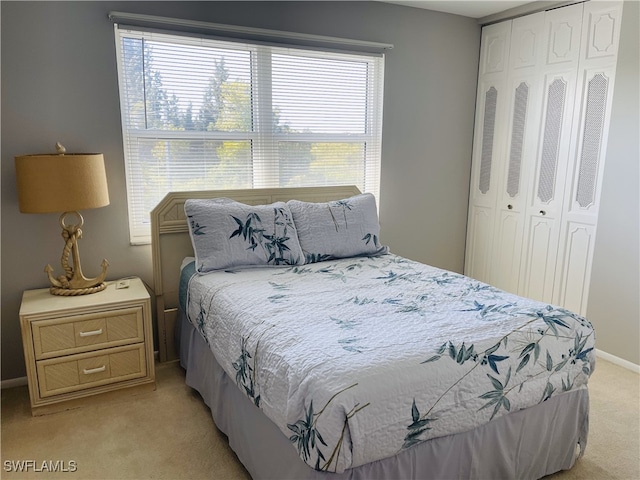 carpeted bedroom with a closet