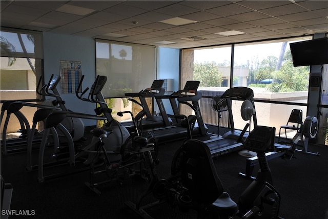 gym featuring a paneled ceiling