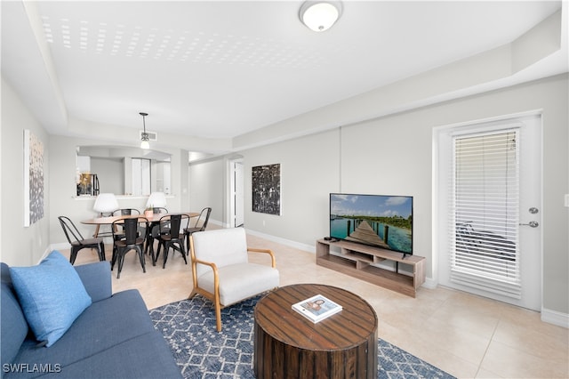 living room with tile patterned floors