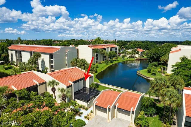 birds eye view of property featuring a water view