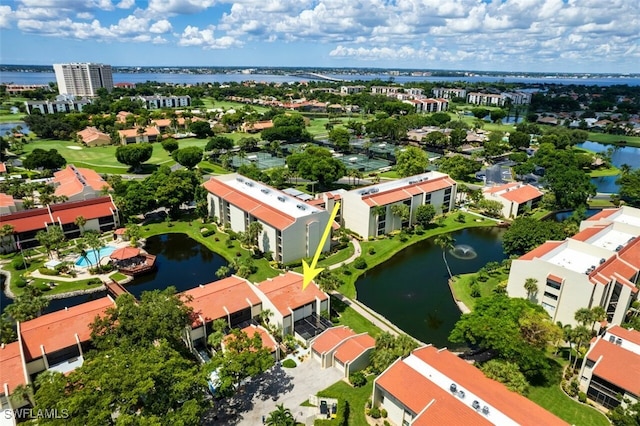 birds eye view of property with a water view