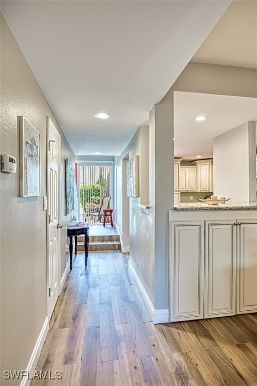 hall with light wood-type flooring