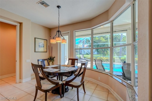 dining area with light tile patterned floors