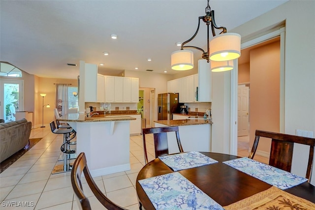 dining space with light tile patterned floors