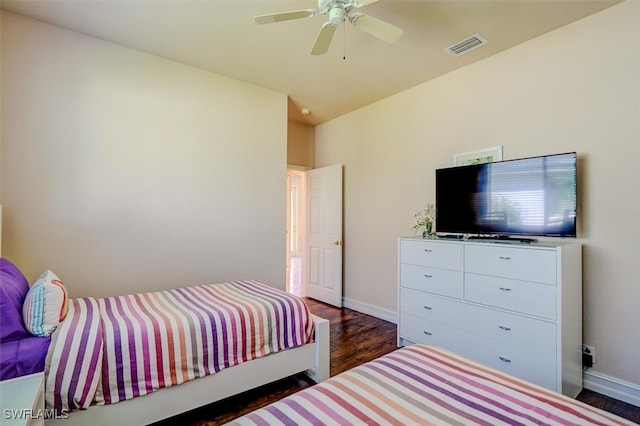 bedroom featuring ceiling fan and dark hardwood / wood-style floors