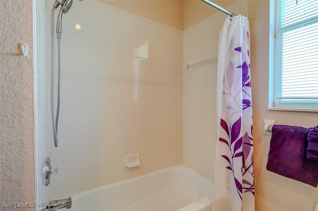 bathroom featuring shower / bath combo with shower curtain