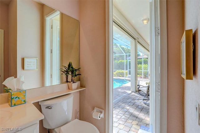 bathroom featuring vanity and toilet