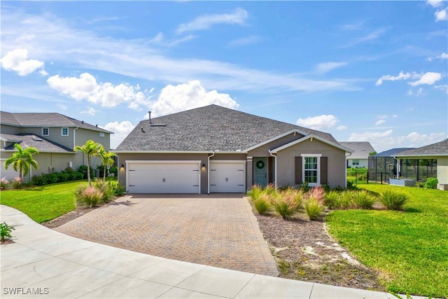 view of front of home with a garage and a front yard