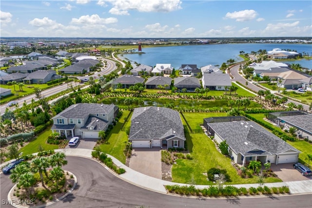 birds eye view of property featuring a water view