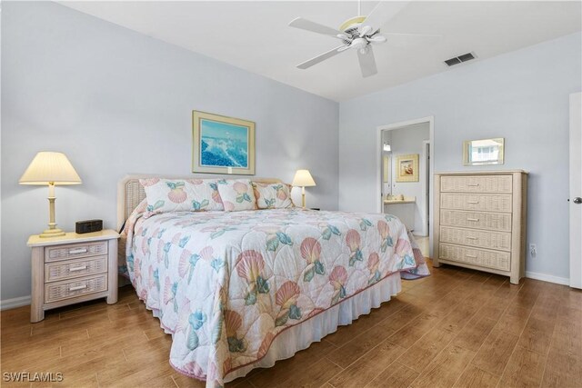 bedroom featuring ceiling fan and ensuite bath