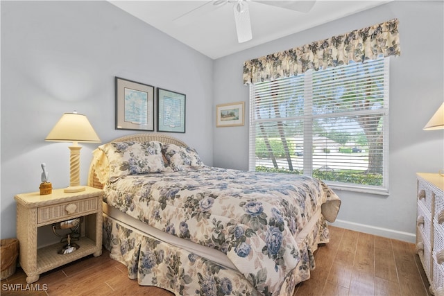 bedroom with ceiling fan and wood-type flooring