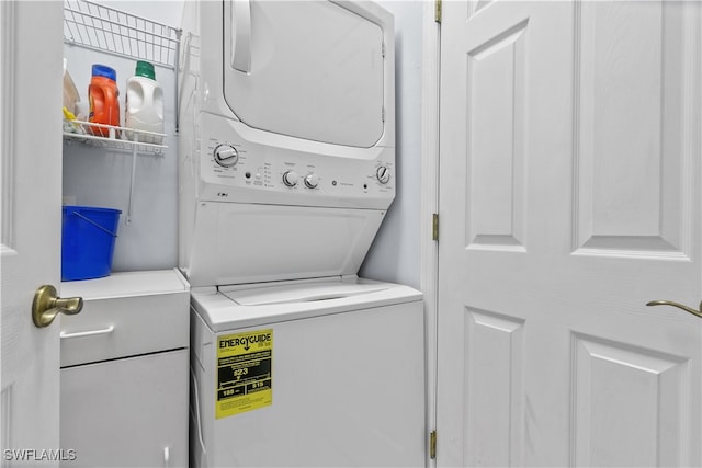 laundry room with stacked washer and dryer