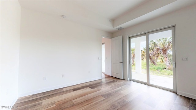 spare room with light wood-type flooring