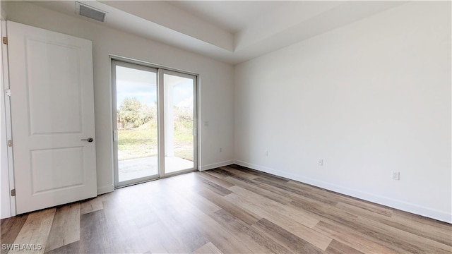 spare room featuring light hardwood / wood-style floors