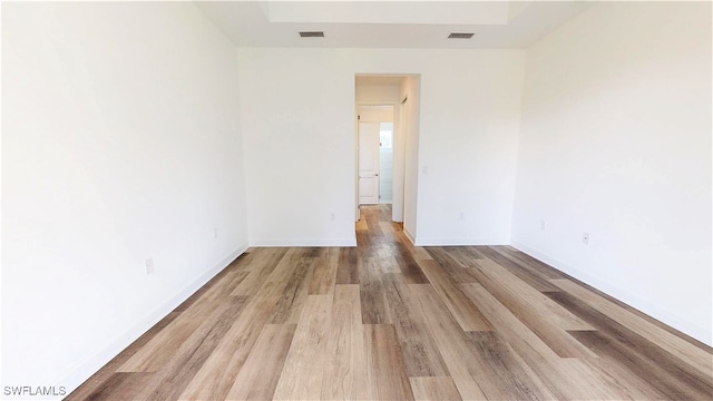 spare room with light wood-type flooring