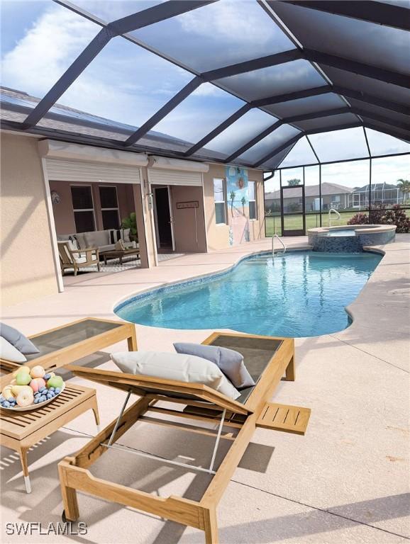 view of pool with an in ground hot tub, a lanai, and a patio