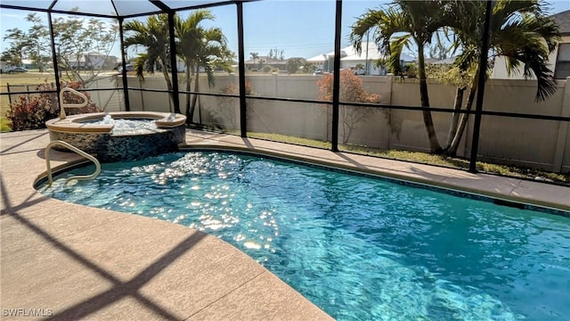 view of swimming pool with a lanai and an in ground hot tub