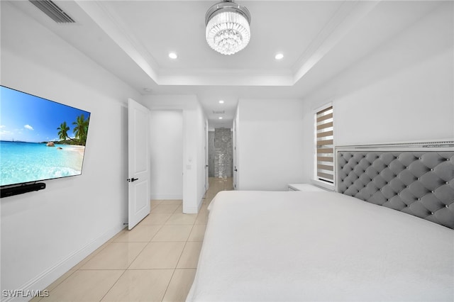 tiled bedroom with a tray ceiling, a chandelier, and crown molding