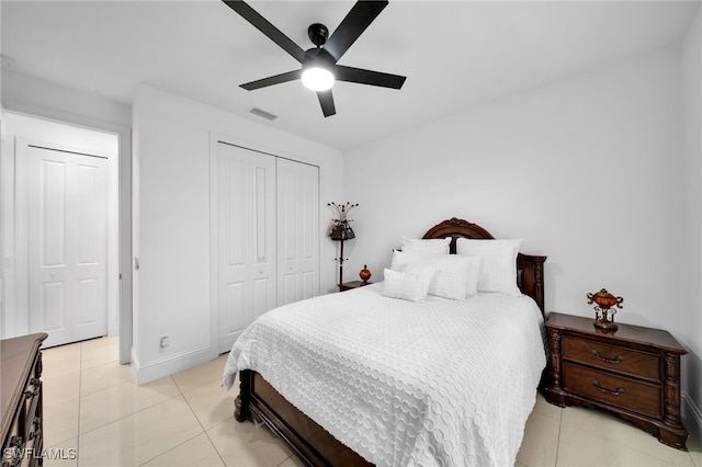 bedroom with ceiling fan and light tile patterned floors