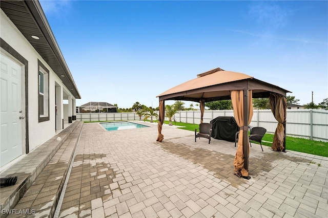 view of patio / terrace featuring a gazebo and a fenced in pool