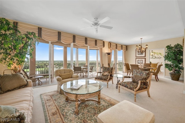 living room featuring ceiling fan with notable chandelier