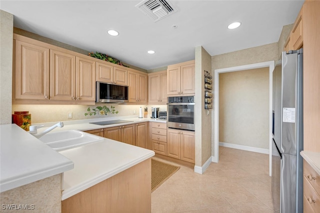 kitchen featuring sink, light tile patterned flooring, stainless steel appliances, and light brown cabinets