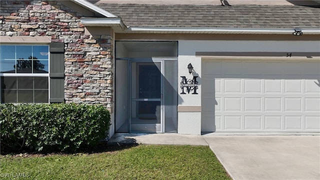 doorway to property featuring a garage